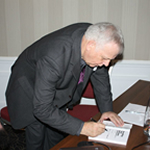 Signing copies of my book after a brand workshop at EADIM.